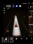 28.11.2021, Weihnachts-Modus auf dem 15-Zoll Bildschirm im Cockpit eines TESLA Model 3, die Darstellung was normalerweise das eigene Auto während des selbstfahrenden Autopiloten auf der Strecke darstellt, wird per kurioser Spracheingabe 