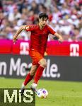 12.05.2024, Fussball 1. Bundesliga 2023/2024, 33.Spieltag, FC Bayern Mnchen - VfL Wolfsburg, in der Allianz-Arena Mnchen. Aleksandar Pavlovic (Bayern Mnchen)  am Ball 

