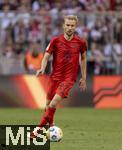 12.05.2024, Fussball 1. Bundesliga 2023/2024, 33.Spieltag, FC Bayern Mnchen - VfL Wolfsburg, in der Allianz-Arena Mnchen. Konrad Laimer (FC Bayern Mnchen) am Ball 

