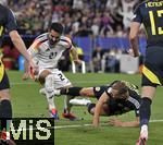 14.06.2024, Fussball UEFA EURO 2024, Vorrunde, 1.Spieltag, Erffnungsspiel Deutschland - Schottland, in der Fuball Arena Mnchen. Ryan Porteous (Schottland) gegen Ilkay Gndogan (Deutschland) 