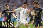 14.06.2024, Fussball UEFA EURO 2024, Vorrunde, 1.Spieltag, Erffnungsspiel Deutschland - Schottland, in der Fuball Arena Mnchen. Kai Havertz (mitte, Deutschland) gegen Jack Hendry (re, Schottland) 