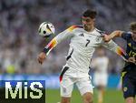 14.06.2024, Fussball UEFA EURO 2024, Vorrunde, 1.Spieltag, Erffnungsspiel Deutschland - Schottland, in der Fuball Arena Mnchen. v.li: Kai Havertz (Deutschland) gegen Jack Hendry (Schottland) 