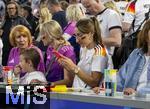 14.06.2024, Fussball UEFA EURO 2024, Vorrunde, 1.Spieltag, Erffnungsspiel Deutschland - Schottland, in der Fuball Arena Mnchen. Freundin von Trainer Julian Nagelsmann (Deutschland),  Lena Wurzenberger freut sich und schaut auf ihr Handy.