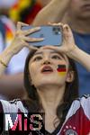 19.06.2024, Fussball UEFA EURO 2024, Vorrunde, 2.Spieltag, Deutschland - Ungarn, in der Stuttgart Arena. Asiatische Zuschauerin mit Deutschland-Flagge auf dem Gesicht.

