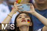 19.06.2024, Fussball UEFA EURO 2024, Vorrunde, 2.Spieltag, Deutschland - Ungarn, in der Stuttgart Arena. Asiatische Zuschauerin mit Deutschland-Flagge auf dem Gesicht.

