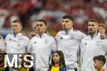 23.06.2024, Fussball UEFA EURO 2024, Vorrunde, 3.Spieltag, Schweiz - Deutschland, in der Frankfurt-Arena in Frankfurt am Main, Aufstellung zur Nationalhymne, v.li: Toni Kroos (Deutschland), Jamal Musiala (Deutschland), Kai Havertz (Deutschland), Robert Andrich (Deutschland), 
