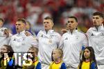 23.06.2024, Fussball UEFA EURO 2024, Vorrunde, 3.Spieltag, Schweiz - Deutschland, in der Frankfurt-Arena in Frankfurt am Main, Aufstellung zur Nationalhymne, v.li: Josua Kimmich (Deutschland), Toni Kroos (Deutschland), Jamal Musiala (Deutschland), Kai Havertz (Deutschland), 
