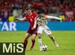 23.06.2024, Fussball UEFA EURO 2024, Vorrunde, 3.Spieltag, Schweiz - Deutschland, in der Frankfurt-Arena in Frankfurt am Main, v.li: Remo Freuler (Schweiz) gegen Jamal Musiala (Deutschland).
