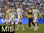 05.07.2024, Fussball UEFA EURO 2024, Viertelfinale, Spanien - Deutschland, in der Stuttgart-Arena. v.l. Thomas Mller (Deutschland), Niclas Fllkrug (Deutschland) und Toni Kroos (Deutschland) sind enttuscht.

