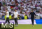 05.07.2024, Fussball UEFA EURO 2024, Viertelfinale, Spanien - Deutschland, in der Stuttgart-Arena. Frust nach dem verlorenen Spiel und dem Ausscheiden bei Trainer Julian Nagelsmann (re, Deutschland) der auch ein paar Trnen vergiesst. li: Co-Trainer Sandro Wagner (Deutschland) und Co-Trainer Benjamin Glck (Deutschland) 

