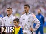 05.07.2024, Fussball UEFA EURO 2024, Viertelfinale, Spanien - Deutschland, in der Stuttgart-Arena. v.li: Toni Kroos (Deutschland) und Kai Havertz (Deutschland) 

