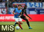 14.09.2024, Fussball 1. Bundesliga 2024/2025, 3. Spieltag, Holstein Kiel - FC Bayern Mnchen, im Holstein-Stadion Kiel. (L-R) Shuto Machino (Holstein Kiel) gegen Dayot Upamecano (Bayern Mnchen)


