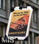 15.02.2024, Demonstration gegen AfD-Wahlkampfveranstaltung in Dsseldorf. Schild ?When you ride TESLA you ride with Hitler! Swasticars?.