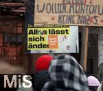 15.02.2024, Demonstration gegen AfD-Wahlkampfveranstaltung in Dsseldorf. Wahlkampfplakat der FDP-Kandidatin Dr. Lida Azarnoosh mit Slogan ?Alles lsst sich ndern?, darauf verschiedene Sticker, unter anderem ?Brandmauer wo?? und ?FCK NZS?.