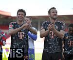19.04.2025, Fussball 1. Bundesliga 2024/2025, 30. Spieltag, 1.FC Heidenheim - FC Bayern Mnchen, in der Voith-Arena Heidenheim. v.l. Thomas Mller (FC Bayern Mnchen) und Harry Kane (FC Bayern Mnchen) jubeln.

