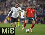 04.06.2025, Fussball UEFA Nations League 2024/25,  Halbfinale, Deutschland - Portugal, in der Allianz-Arena Mnchen. v.l. Nick Woltemade (Deutschland) gegen Ruben Dias (Portugal) 