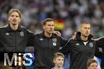 04.06.2025, Fussball UEFA Nations League 2024/25,  Halbfinale, Deutschland - Portugal, in der Allianz-Arena Mnchen. Aufstellung zur Nationalhymne, von links:  Nick Woltemade (Deutschland), Leon Goretzka (Deutschland), Waldemar Anton (Deutschland), 