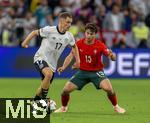 04.06.2025, Fussball UEFA Nations League 2024/25,  Halbfinale, Deutschland - Portugal, in der Allianz-Arena Mnchen. v.li: Florian Wirtz (Deutschland) gegen Joao Neves (Portugal) am Ball 
