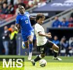 08.06.2025, Fussball UEFA Nations League 2024/25,  Spiel um Platz 3, Deutschland - Frankreich, in der MHP-Arena Stuttgart, v.li: Randal Kolo Muani (Frankreich) gegen Karim Adeyemi (Deutschland) 