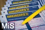 28.03.2023, Lotto Bayern, Eurojackpot-Scheine, Angekreuzte Tippscheine auf dem Tisch. 