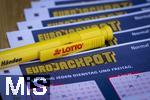 28.03.2023, Lotto Bayern, Eurojackpot-Scheine, Angekreuzte Tippscheine auf dem Tisch. 