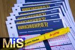 28.03.2023, Lotto Bayern, Eurojackpot-Scheine, Angekreuzte Tippscheine auf dem Tisch. 