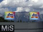 29.6.2025, Imst in Tirol, dm-Firmenschild vor dem Alpenkamm-Hintergrund. 