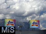29.6.2025, Imst in Tirol, dm-Firmenschild vor dem Alpenkamm-Hintergrund. 