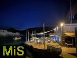 23.07.2025,  Beliebtes Reiseziel der Deutschen, Mallorca. Hier Cala Ratjada am Strand Cala Agulla.  Das Cafe Beach-Club Sa Cova am Mero-Diving-Center an der Cala Lliteras am Abend.