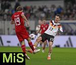 14.11.2025, Fussball WM-Qualifikation Europa 2025/26, 9.Spieltag,  Luxemburg - Deutschland, im Stade de Luxembourg (Croix de Gasperich, Luxemburg), v.l. Mathias Olesen (Luxemburg) gegen Florian Wirtz (Deutschland) 