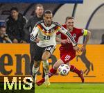 14.11.2025, Fussball WM-Qualifikation Europa 2025/26, 9.Spieltag,  Luxemburg - Deutschland, im Stade de Luxembourg (Croix de Gasperich, Luxemburg), li: Leroy Sane (Deutschland) gegen Laurent Jans (Luxemburg) 