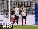 14.11.2025, Fussball WM-Qualifikation Europa 2025/26, 9.Spieltag,  Luxemburg - Deutschland, im Stade de Luxembourg (Croix de Gasperich, Luxemburg), v.li: Torwart Finn Dahmen (Deutschland), Jonathan Burkhardt (Deutschland), 