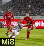21.12.2025, Fussball Bundesliga 2025/2026, 15.Spieltag, 1.FC Heidenheim - FC Bayern M�nchen, in der Voith-Arena Heidenheim. Harry Kane (mitte, FC Bayern M�nchen) gegen Patrick Mainka (1. FC Heidenheim) 