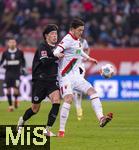 31.01.2026, Fussball 1. Bundesliga 2025/2026, 20.Spieltag, FC Augsburg - FC St. Pauli, in der WWK-Arena Augsburg. v.li: Tomoya Ando (St. Pauli) gegen Michael Gregoritsch (Augsburg) 