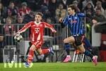 18.03.2026,  Fussball UEFA Championsleague 2025/2026: Achtelfinale Rückspiel,  FC Bayern München - Atalanta Bergamo, in der Allianz-Arena München, v.l. Lennart Karl (FC Bayern München) gegen Lorenzo Bernasconi (Atalanta Bergamo) 
  

