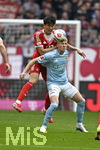 21.03.2026, Fussball Bundesliga 2025/2026, 27.Spieltag, FC Bayern München - 1.FC Union Berlin, in der Allianz-Arena München,      v.l. Min-jae Kim (Bayern München, Minjae Kim) gegen Tim Skarke (Union Berlin) 


