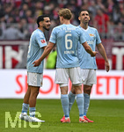 21.03.2026, Fussball Bundesliga 2025/2026, 27.Spieltag, FC Bayern München - 1.FC Union Berlin, in der Allianz-Arena München,      v.l. Livan Burcu (Union Berlin), Rani Khedira (Union Berlin) und  Aljoscha Kemlein (Union Berlin) nachdenklich

