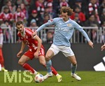 21.03.2026, Fussball Bundesliga 2025/2026, 27.Spieltag, FC Bayern München - 1.FC Union Berlin, in der Allianz-Arena München,      v.l. Josip Stanisic (Bayern München) gegen Alex Kral (Union Berlin) 


