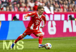 21.03.2026, Fussball Bundesliga 2025/2026, 27.Spieltag, FC Bayern München - 1.FC Union Berlin, in der Allianz-Arena München, Lennart Karl (FC Bayern München) am Ball 