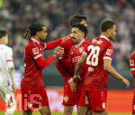 22.03.2026, Fussball 1. Bundesliga 2025/2026, 27.Spieltag, FC Augsburg - VfB Stuttgart, in der WWK-Arena Augsburg.  Torjubel Lorenz Assignon (Stuttgart), Tiago Tomas (Stuttgart), Nikolas Nartey (Stuttgart), 