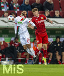 22.03.2026, Fussball 1. Bundesliga 2025/2026, 27.Spieltag, FC Augsburg - VfB Stuttgart, in der WWK-Arena Augsburg. v.li: Alexis Julian Claude-Maurice (FC Augsburg) gegen Finn Jeltsch (Stuttgart) 