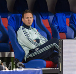 27.03.2026, Fussball Freundschafts-Länderspiel, Schweiz - Deutschland, im Stadion St.-Jakob-Park in Basel (Schweiz). Trainer Julian Nagelsmann (Deutschland) nachdenklich auf der Bank 