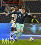 30.03.2026, Fussball Freundschafts-Länderspiele 2.Spieltag, Deutschland - Ghana, in der MHP-Arena Stuttgart (Deutschland). v.l. Derrick Köhn (Ghana) gegen Lennart Karl (Deutschland) 