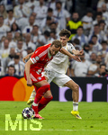 07.04.2026, Fussball UEFA Championsleague 2025/2026: Viertelfinale, Real Madrid - FC Bayern München, im Estadio Bernabeu in Madrid (Spanien),  v.re. Thiago Pitarch (Real Madrid) gegen Harry Kane (FC Bayern München) 
  
