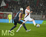 10.04.2026, Fussball 1. Bundesliga 2025/2026, 29.Spieltag, FC Augsburg - TSG 1899 Hoffenheim, in der WWK-Arena Augsburg. v.l. Albian Hajdari (TSG 1899 Hoffenheim) gegen Michael Gregoritsch (Augsburg) 
 


