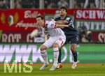 10.04.2026, Fussball 1. Bundesliga 2025/2026, 29.Spieltag, FC Augsburg - TSG 1899 Hoffenheim, in der WWK-Arena Augsburg. v.li: Michael Gregoritsch (Augsburg) gegen Ozan Kabak (TSG 1899 Hoffenheim) 