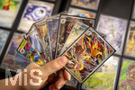 05.08.2026, Deutschland, Bayern, Pokemon-Sammelkarten, eine Teenagerin sammelt begeistert Pokemon-Karten in ihrem Sammelheft. 