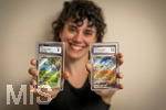 05.08.2026, Deutschland, Bayern, Pokemon-Sammelkarten, eine Teenagerin (Viola) sammelt begeistert Pokemon-Karten. (Modelreleased)   