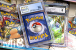 05.08.2026, Deutschland, Bayern, Pokemon-Sammelkarten, eine Teenagerin sammelt begeistert Pokemon-Karten.  