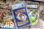 05.08.2026, Deutschland, Bayern, Pokemon-Sammelkarten, eine Teenagerin sammelt begeistert Pokemon-Karten.  